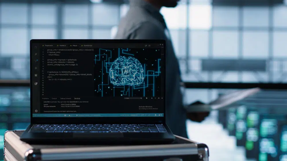 Computador exibindo código e visualização de machine learning, com foco em inteligência artificial.